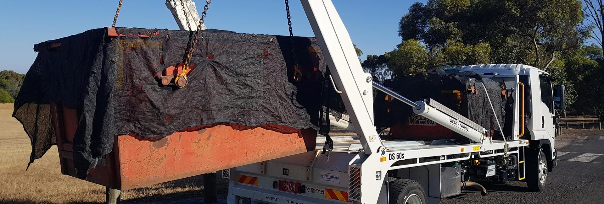 Truck Loading Skip Bin in Melbourne